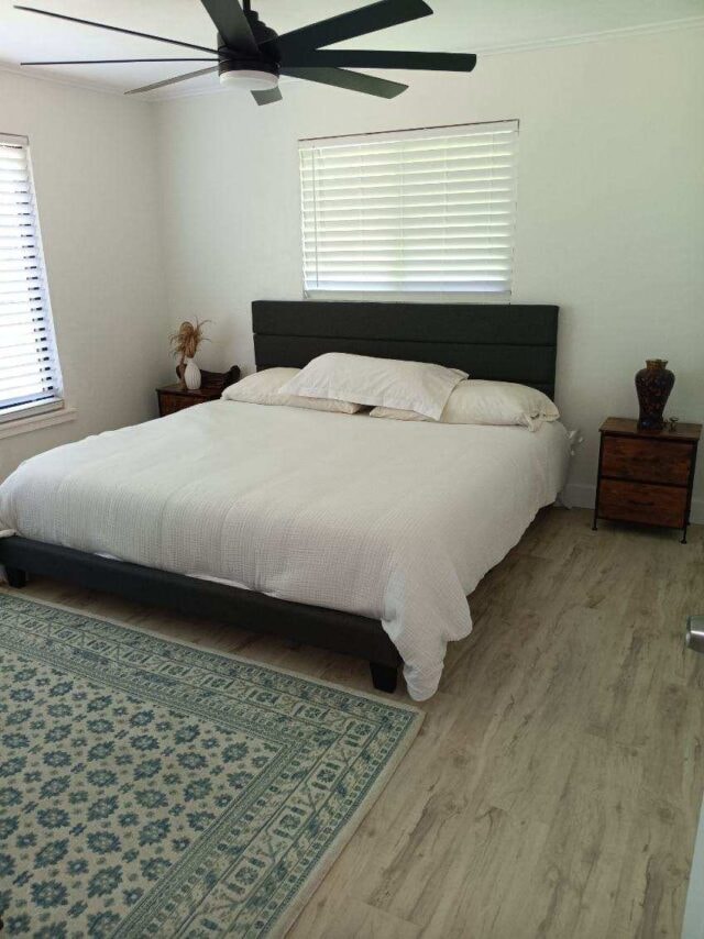 Clean bedroom with ceiling fan